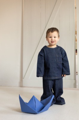 Children’s studio portrait photography with playful movement and modern fashion aesthetics