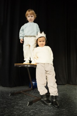 Collage of expressive children in soft pastel outfits under stage lighting — playful studio kids fashion editorial. 