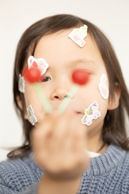 Children’s studio portrait photography with playful movement and modern fashion aesthetics