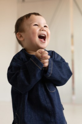 Children’s studio portrait photography with playful movement and modern fashion aesthetics