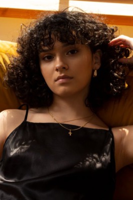 Intimate natural light portrait series with warm tones and minimal styling by Berlin photographer Miriam Dang