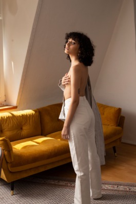 Intimate natural light portrait series with warm tones and minimal styling by Berlin photographer Miriam Dang